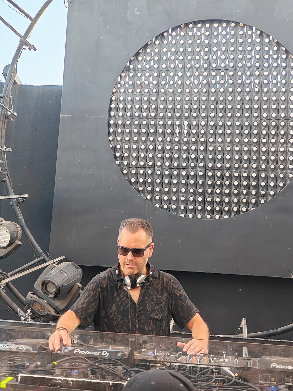 Ace Ventura behind DJ equipment in June 2026.