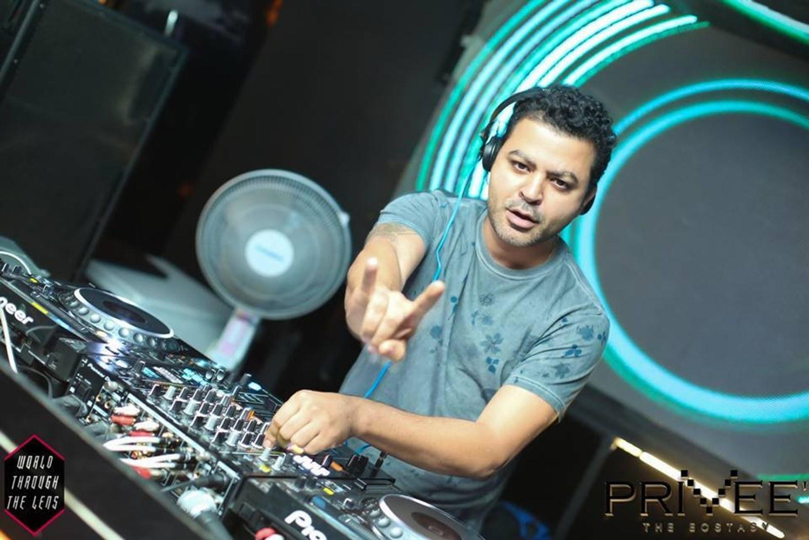 Tengri at a laptop and mixer in the featured artist image assigned by Parvati Records.