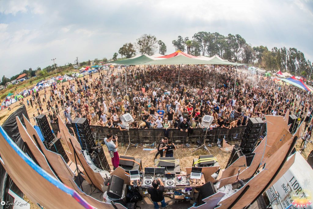 Cosmic Tone performing at Doof Festival, photographed from the stage toward the festival crowd.